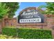 The Manors South at Westridge brick community sign surrounded by manicured hedges at 824 Casterton Cir, Davenport, FL 33897