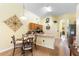Cozy breakfast nook featuring a table with seating and kitchen counter and cabinets at 824 Casterton Cir, Davenport, FL 33897
