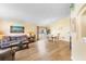 Bright living room with hardwood floors and large windows and combined dining room at 824 Casterton Cir, Davenport, FL 33897