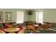 Community meeting room with multiple tables and chairs for gatherings and events at 824 Casterton Cir, Davenport, FL 33897