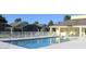 Community pool featuring lounge chairs and covered seating areas for residents to enjoy at 824 Casterton Cir, Davenport, FL 33897