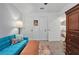 Cozy room with a blue sofa, decorative pillows, a colorful rug, and bright lighting at 832 Donnelly Pl, Daytona Beach, FL 32114