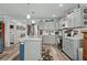 Spacious kitchen with updated cabinets and counters, an island and stainless steel refrigerator at 832 Donnelly Pl, Daytona Beach, FL 32114
