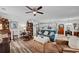 Open living room with wood floors flows into a modern kitchen, ideal for entertaining at 832 Donnelly Pl, Daytona Beach, FL 32114