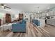 Open-concept living room with hardwood floors seamlessly connects to a modern kitchen at 832 Donnelly Pl, Daytona Beach, FL 32114