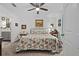 Comfortable bedroom with a ceiling fan, bright windows, and carpet floors at 832 Donnelly Pl, Daytona Beach, FL 32114