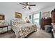 Cozy bedroom with a ceiling fan, bright windows, comfortable furniture, and carpet floors at 832 Donnelly Pl, Daytona Beach, FL 32114