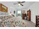 Inviting bedroom with a ceiling fan, bright windows, comfortable furniture, and carpet floors at 832 Donnelly Pl, Daytona Beach, FL 32114