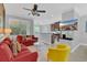 Inviting living room featuring a large window, neutral walls, and modern furnishings at 893 Assembly Ct, Reunion, FL 34747