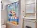 Bathroom with tub and colorful baby shark shower curtain at 910 Braddock Rd, Enterprise, FL 32725