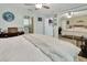 Large bedroom with ensuite bathroom, tile floors, and mirrored closet at 910 Braddock Rd, Enterprise, FL 32725