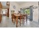 Inviting dining area with tiled floors, a wooden table, and access to the screened porch at 910 Braddock Rd, Enterprise, FL 32725