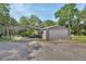Detached garage with car port and gravel driveway at 910 Braddock Rd, Enterprise, FL 32725