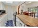 Kitchen with butcher block countertops, modern oven, and breakfast nook leading to the back patio at 910 Braddock Rd, Enterprise, FL 32725