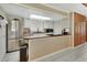 Bright kitchen features stainless steel appliances, butcher block countertops, and light-filled skylight at 910 Braddock Rd, Enterprise, FL 32725