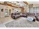 Open-concept living area with exposed beams, natural light and an adjoining kitchen at 910 Braddock Rd, Enterprise, FL 32725