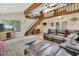 Comfortable living room featuring a staircase, large windows, and plenty of natural light at 910 Braddock Rd, Enterprise, FL 32725