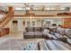 Comfortable living room with staircase, views into the kitchen and views to the back porch at 910 Braddock Rd, Enterprise, FL 32725