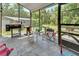 Screened patio with outdoor seating and grill at 910 Braddock Rd, Enterprise, FL 32725