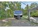 RV with metal cover next to gravel driveway at 910 Braddock Rd, Enterprise, FL 32725