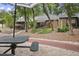 Community backyard featuring green picnic benches in a park-like setting with mature trees at 940 Douglas Ave # 189, Altamonte Springs, FL 32714