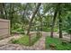 Picturesque backyard view with mature trees, water feature, and pedestrian bridge at 940 Douglas Ave # 189, Altamonte Springs, FL 32714
