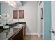 Bathroom featuring a decorative mirror, granite countertop and colorful walls at 940 Douglas Ave # 189, Altamonte Springs, FL 32714