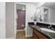 Bathroom features a granite countertop vanity, decorative mirror, and tile floor at 940 Douglas Ave # 189, Altamonte Springs, FL 32714