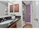 Bathroom vanity features granite countertop, wood cabinets, and a shower stall at 940 Douglas Ave # 189, Altamonte Springs, FL 32714