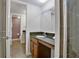 Bathroom featuring vanity with granite countertop and a shower with glass doors at 940 Douglas Ave # 189, Altamonte Springs, FL 32714
