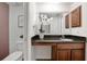 Bathroom with vanity, decorative mirror, and a floral arrangement at 940 Douglas Ave # 189, Altamonte Springs, FL 32714