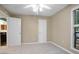 Bedroom with neutral walls, carpet, ceiling fan, and view to an en suite bathroom at 940 Douglas Ave # 189, Altamonte Springs, FL 32714