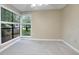 Bedroom featuring neutral carpet and large corner windows at 940 Douglas Ave # 189, Altamonte Springs, FL 32714