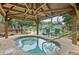 Hot tub under a gazebo with nearby pool and lounge chairs in community area at 940 Douglas Ave # 189, Altamonte Springs, FL 32714