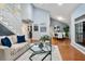 Open living area featuring hardwood floors, natural light, and a view into the dining room at 940 Douglas Ave # 189, Altamonte Springs, FL 32714