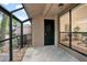 Enclosed patio with concrete flooring, rock details, and access to the home at 940 Douglas Ave # 189, Altamonte Springs, FL 32714