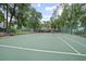 Community tennis courts are well maintained and surrounded by lush landscaping at 940 Douglas Ave # 189, Altamonte Springs, FL 32714