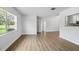 Bright living room with wood floors and large window providing ample natural light at 952 N Fairbairn Dr, Deltona, FL 32725