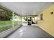 A screened patio offers an outdoor space, connecting the home to the backyard at 952 N Fairbairn Dr, Deltona, FL 32725
