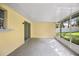 The enclosed screened patio is accessible from a sliding door and offers shade and comfort at 952 N Fairbairn Dr, Deltona, FL 32725