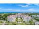 Stunning aerial view of the condominium building complex overlooking the ocean and golf course at 1 John Anderson Dr # 3170, Ormond Beach, FL 32176