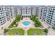 The community pool is located in a courtyard setting with lush landscaping and mature palms at 1 John Anderson Dr # 3170, Ormond Beach, FL 32176