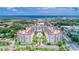 Beautiful aerial shot of condo complex near the ocean, showcasing its red-tile roofs and lush surroundings at 1 John Anderson Dr # 3170, Ormond Beach, FL 32176