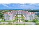 Stunning aerial view of a coastal condo building featuring a central pool and lush landscaping at 1 John Anderson Dr # 3170, Ormond Beach, FL 32176