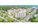 An aerial view of a condo building with landscaped surroundings, a golf course, and the ocean in the background at 1 John Anderson Dr # 3170, Ormond Beach, FL 32176
