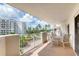 Relax on this spacious condo balcony with views of the building and surrounding tropical landscape at 1 John Anderson Dr # 3170, Ormond Beach, FL 32176