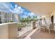 Condo balcony with seating offers stunning views of the building and the beautifully landscaped grounds at 1 John Anderson Dr # 3170, Ormond Beach, FL 32176