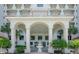The covered entryway is flanked by palm trees and features a fountain as its centerpiece at 1 John Anderson Dr # 3170, Ormond Beach, FL 32176