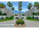 The front entrance has lush landscaping and mature palms that creates a welcoming scene at 1 John Anderson Dr # 3170, Ormond Beach, FL 32176