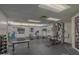 Well-lit workout area with various machines, free weights, and black rubber flooring at 1 John Anderson Dr # 3170, Ormond Beach, FL 32176